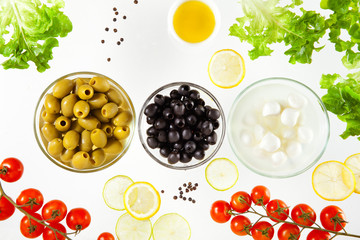 different types of olives and mozzarella with cherry tomatoes an