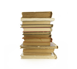 Old, yellowed books on a white background