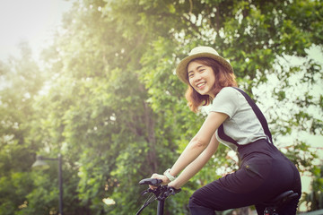 Asian girl ride bicycle