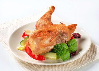 Roast chicken with vegetable garnish