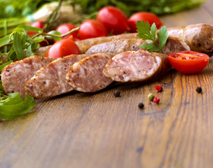 Smoked sausages with greens, cherry tomatoes 