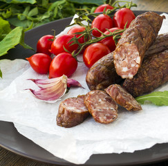 Smoked sausages with greens, cherry tomatoes 