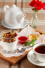 Obraz na płótnie Canvas Yogurt with muesli and nuts