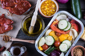 Fototapeta na wymiar Pork in sticky glaze and fresh vegetables for home party barbecu