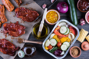 Fototapeta na wymiar Pork in sticky glaze and fresh vegetables for home party barbecu