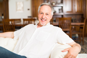 Smiling man relaxing on the couch