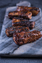 Crispy pork belly slices on granite board