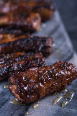 Crispy pork belly slices on granite board