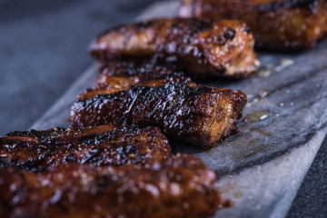 Crispy pork belly slices on granite board