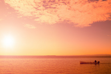 Fototapeta premium Fishing boat at Sunset in the Ocean