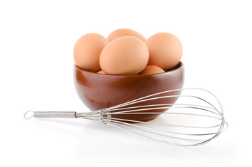 Brown Eggs in a bowl with whisk