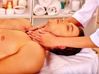 Obraz na płótnie Canvas Man getting facial massage .