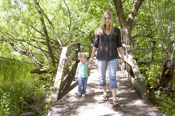 Mother and daughter in forest