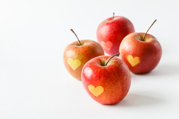 Red apples with a heart symbol