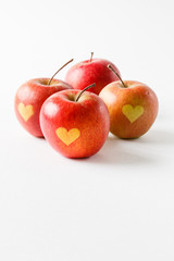 Red apples with a heart symbol