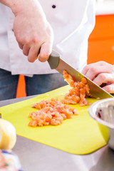 chef cutting fish