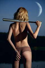 topless girl back baring ass stood by the river with the bat aga