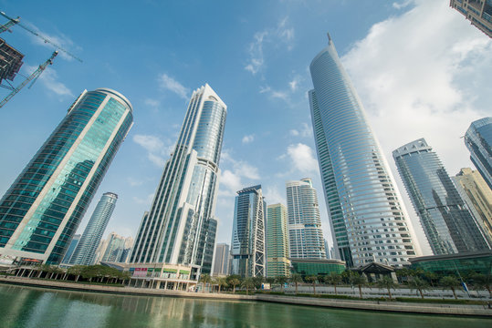 Tall skyscrapers in Dubai near water