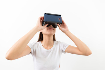 Young woman watching though the virtual reality device