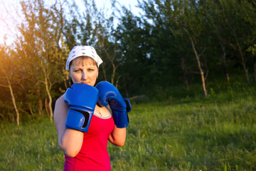 Fototapeta premium Girl with boxing gloves