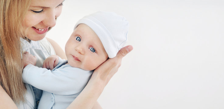 Happy Caring Mother And Her Cute Baby Boy