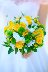 bride holds a wedding bouquet