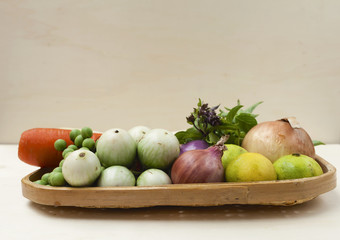 Fresh vegetables basket with space on wood background