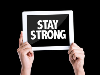 Tablet pc with text Stay Strong isolated on black background