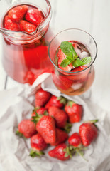 Fototapeta na wymiar Fresh strawberry with cooling homemade cocktail