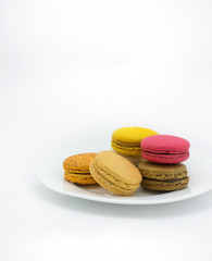 Colorful macarons on white background
