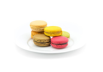 Colorful macarons on white background