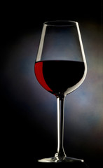 Glass of red wine on dark background