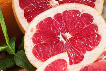Fototapeta na wymiar Sliced fresh grapefruit, selective focus