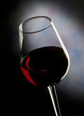 Glass of red wine on dark background