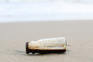 Coffe Bottle abandoned on the beach