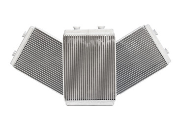 Fototapeta premium three new automotive radiator stove on a white background