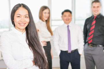 Fototapeta premium Successful asian business woman with business team