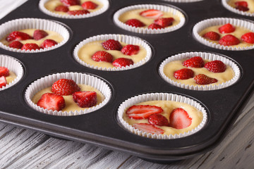 cooking strawberry muffins in baking dish macro