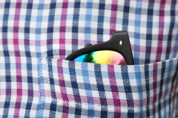 Sunglasses in a shirt pocket.