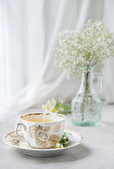 Obraz na płótnie Canvas Cup of camomile tea, morning still-life,