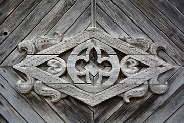 Old Slavonic symbol on the vintage wooden house