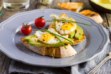 toast with fried quail eggs and avocado