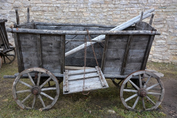Fototapeta na wymiar Old wooden waggon at the ancient Izborsk fortress