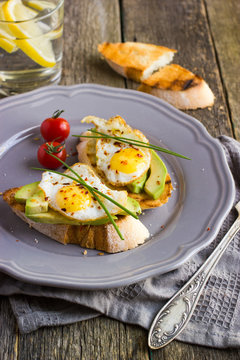 toast with fried quail eggs and avocado