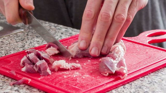 Cutting the meat into small pieces for beef stew