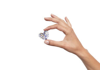hand holding heart shape of diamond