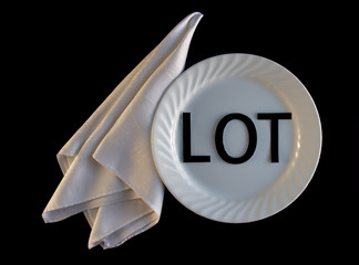 LOT On My Plate With Napkin on Black Background