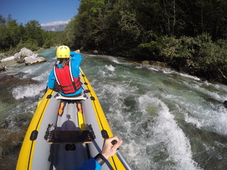 Paddling on wild river, sight from canoe on whitewater