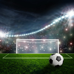 Fototapeta premium Soccer ball on green stadium arena