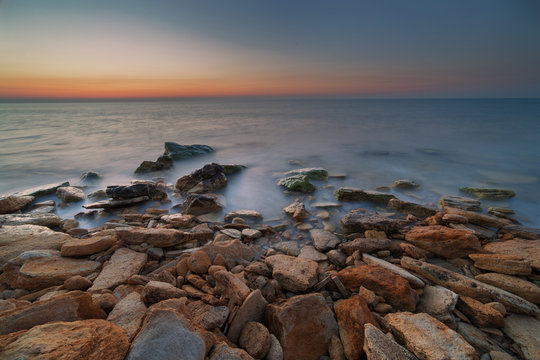 Fototapeta Dawn over the sea on long exposure